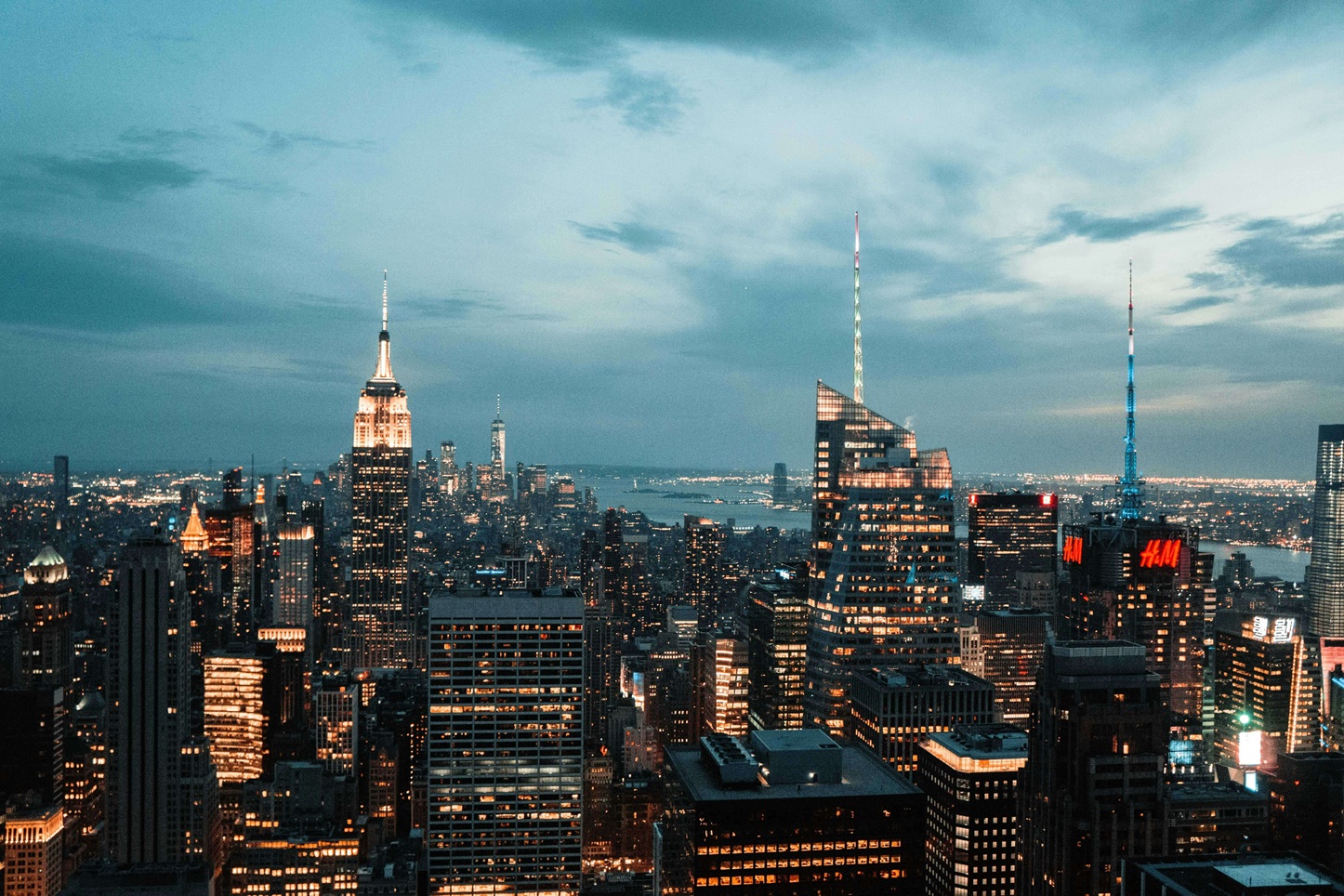 Aerial view of New York City skyline under a cloudy sky