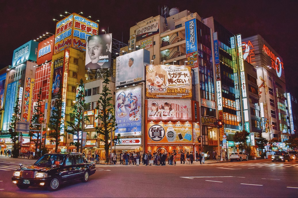Shibuya Crossing in Tokyo at night with neon lights